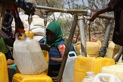 Oxfam East Africa - Newly arrived refugees collect water from Oxfam taps.jpg