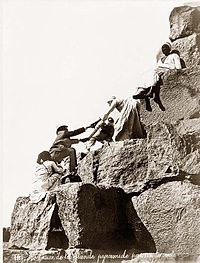 Egypt Great Pyramide tourist ascending 1875.jpg